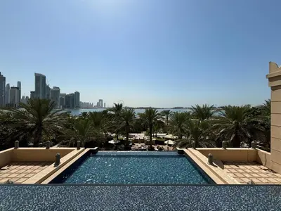 a swimming pool with a view of the city at Frank Porter - Fairmont Residence South in Dubai