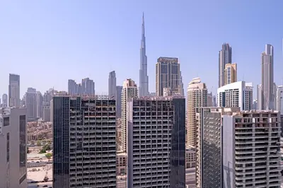 a view of a city skyline with tall buildings at Alluring 1 BD Apartment in Business Bay with Burj Khalifa view in Dubai