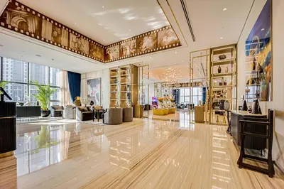 a lobby of a building with a lot of furniture at Luxury 2 Bedroom in Paramount Midtown Residence in Dubai
