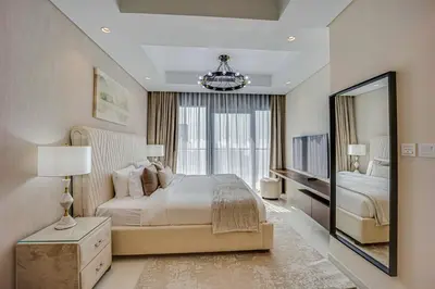 a bedroom with a large bed and a large window at Luxury 2 Bedroom in Paramount Midtown Residence in Dubai