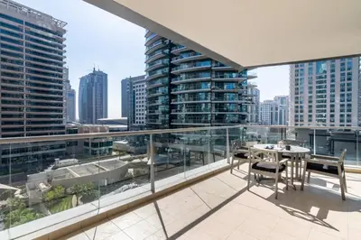 an apartment balcony with a view of the city at The Smart Concierge - Marina Scape in Dubai