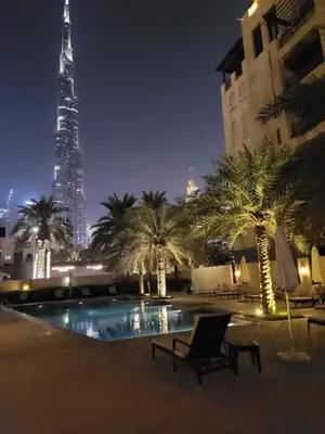 a view of the burj khalifa at night at Luxury 3 Bedroom Apartment - DUBAI MALL 5 min Walk in Dubai