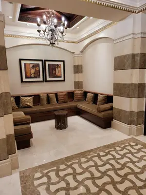 a large room with couches and a chandelier at Luxury 3 Bedroom Apartment - DUBAI MALL 5 min Walk in Dubai