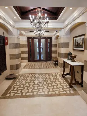 a large hallway with a chandelier and a table in a room at Luxury 3 Bedroom Apartment - DUBAI MALL 5 min Walk in Dubai