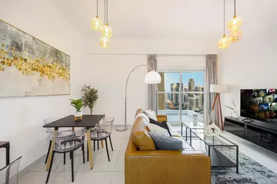 a living room with a couch and a table at Stunning Space with Full Marina View in Dubai