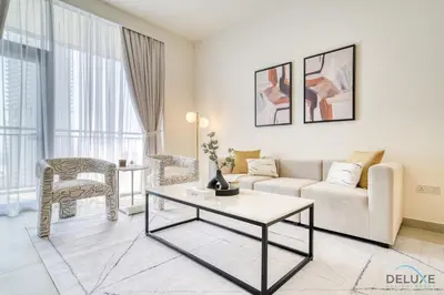a living room with a couch and a table at Peaceful 1BR at Creek Rise Tower 2 Dubai Creek Harbour by Deluxe Holiday Homes in Dubai
