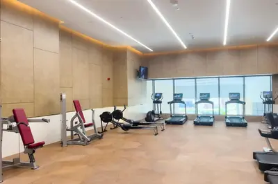 a gym with treadmills and exercise equipment in a room at FAM Living - Palm Tower - Palm Jumeirah - Panoramic Studios in Dubai
