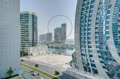 a view of a city with tall buildings at Elegant 1BR with Sofa Bed Close to Metro in Dubai