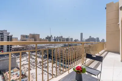a balcony with a view of a city at RH- Bright 1BR in JVC, near Circle mall in Dubai