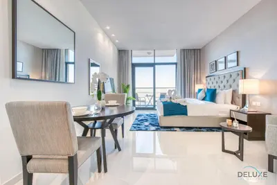 a bedroom with a bed and a dining room at Peaceful Studio at Celestia A Dubai South by Deluxe Holiday Homes in Dubai