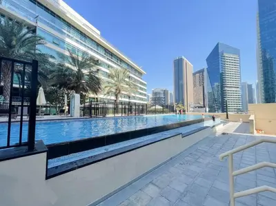 a swimming pool in the middle of a city at Astonishing 3BDR in the heart of Dubai Marina in Dubai