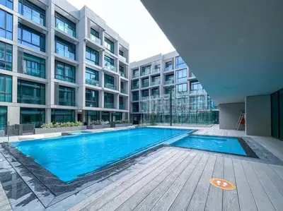 a swimming pool in the middle of a building at Fantastic Studio resort style facilities - OFFER in Dubai