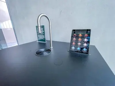 an apple cell phone on a black table with at Fantastic Studio resort style facilities - OFFER in Dubai