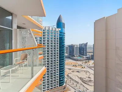 a balcony with a view of a city at Cozy Retreat 1Bedroom on the Business Bay Canal by Suiteable Interiors in Dubai