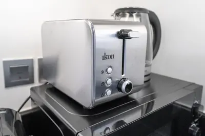 a toaster sitting on top of a stove at At The Top Burj View STUDIO - Special offer in Dubai