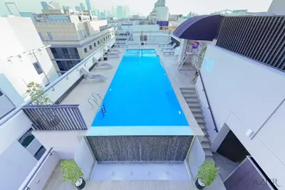 an overhead view of a swimming pool on the roof of a building at Azur Regency Hotel Apartments in Dubai