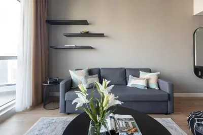 a living room with a couch and a table at Frank Porter - Bay Central Tower 1 in Dubai