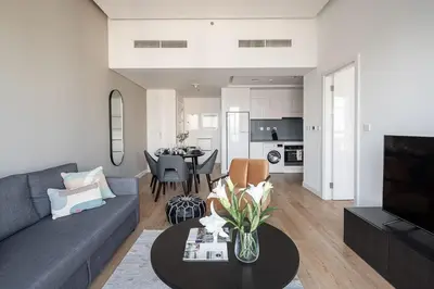 a living room with a couch and a table at Frank Porter - Bay Central Tower 1 in Dubai