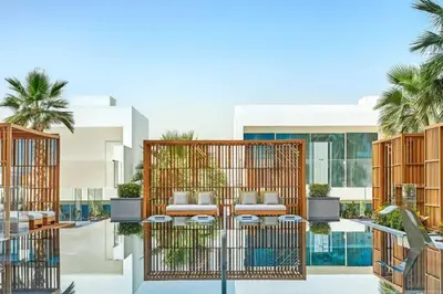 a rendering of the courtyard of a building with tables and chairs at Private Pool Apt. Five Palm Jumeirah up to 6guest in Dubai