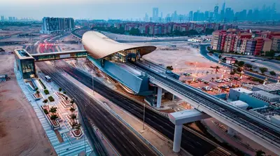 an overhead view of a train station in a city at Discovery Gardens Haven Studios in Dubai