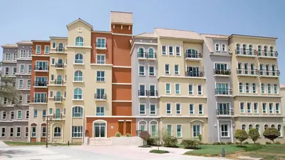 a large apartment building with many windows at Discovery Gardens Haven Studios in Dubai
