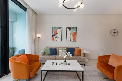 a living room with two couches and a coffee table at Address JBR Sea Views, Jumeirah Beach Residence, Dubai Marina - Mint Stay in Dubai