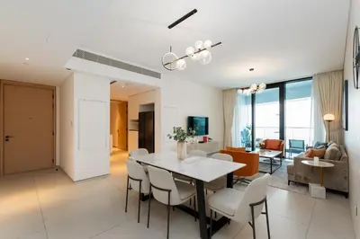 a dining room and living room with a table and chairs at Address JBR Sea Views, Jumeirah Beach Residence, Dubai Marina - Mint Stay in Dubai