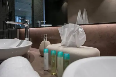 a bathroom with a sink and a tissue box on a counter at Luxury apartment 38th floor Dubai MarinaEXPO OFFER in Dubai