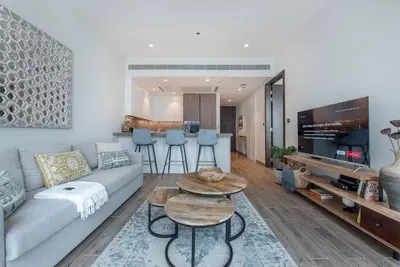 a living room with a couch and a table at Luxury apartment 38th floor Dubai MarinaEXPO OFFER in Dubai