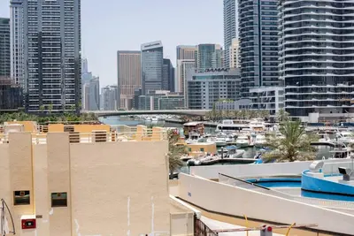 a view of a city skyline with buildings and a pool at Classic Studio With Dubai Marina View in Dubai