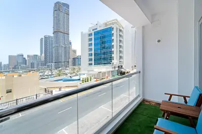 a balcony with a view of a city skyline at Classic Studio With Dubai Marina View in Dubai