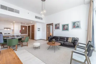 a living room with a couch and a table at Elegant 1br in Zaya Hameni in Dubai