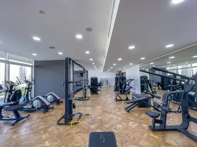 a gym with treadmills and exercise equipment in a building at Elegant 1br in Zaya Hameni in Dubai