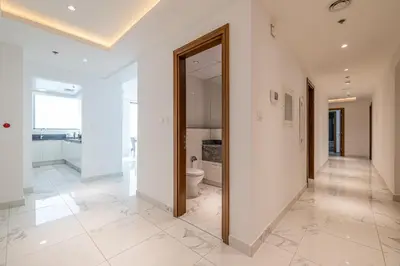 an empty hallway with a toilet in a building at Noora Tower I Spacious 3BDR Apartment and maid room with Burj Khalifa View in Dubai