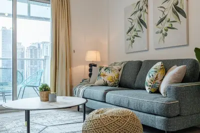 a living room with a couch and a table at 2 Bedroom Apartment I Marina Diamond 4 I Close To Metro in Dubai