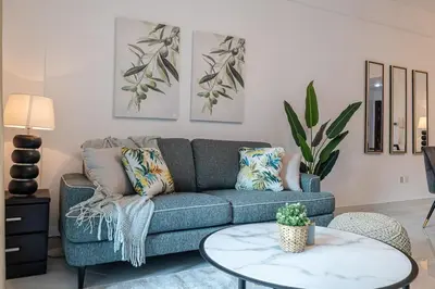 a living room with a couch and a table at 2 Bedroom Apartment I Marina Diamond 4 I Close To Metro in Dubai