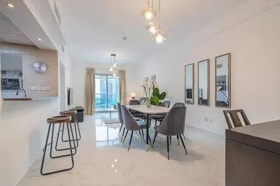a kitchen and dining room with a table and chairs at 2 Bedroom Apartment I Marina Diamond 4 I Close To Metro in Dubai