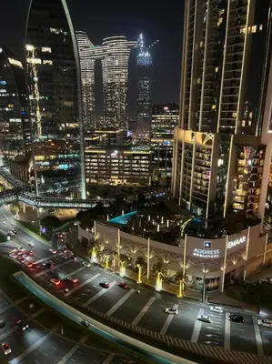 a view of a city at night with traffic at Address Dubai Mall Fashion Avenue Studio 17 floor in Dubai