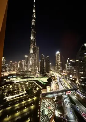 a view of a city at night with traffic at Deluxe Stay - Address Dubai Mall -The Residence in Dubai