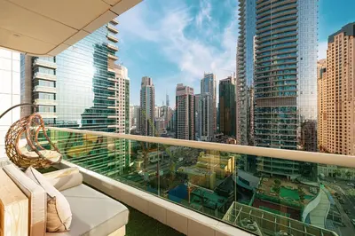a balcony with a view of a city at Lovely Dubai Eye & Sea View, 3 mints to beach in Dubai