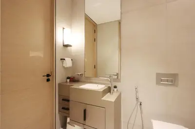 a bathroom with a sink and a mirror at Livbnb - Lush 2BR Suite with Sea and Ain View in Address JBR in Dubai