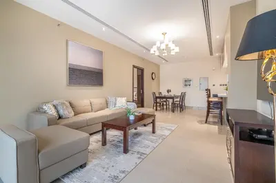 a living room with a couch and a table at Spacious 2BDR Apartment in Business Bay Habtoor City in Dubai