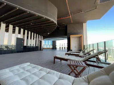 a large room with a couch and chairs on a building at Breathtaking view compact & modern spacious studio in Dubai