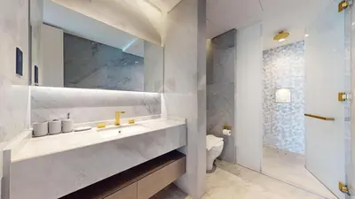 a bathroom with a sink and a toilet at FIVE Palm South -Opulent Two Bedroom with Sea View in Dubai
