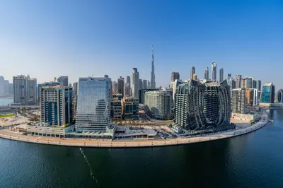 an aerial view of a city with tall buildings at Kasco Homes Waves Tower Business Bay in Dubai
