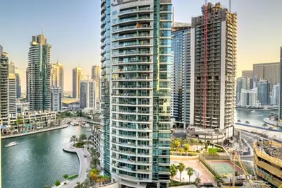 a city skyline with tall buildings and a river at Hot Deal Modern 1BR at Iris Blue, Don't Miss Out by Deluxe Holiday Homes in Dubai