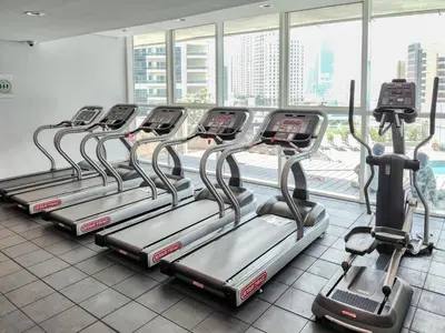 a row of treadmills in a gym at BR Luxe 1 BDR Apartment w/ Balcony & Sea Views in Dubai