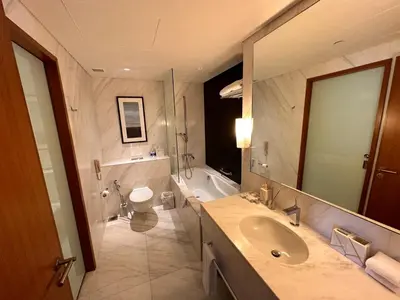 a bathroom with a sink and a toilet and a mirror at Fashion avenue - Formerly Address Dubai Mall Residence in Dubai
