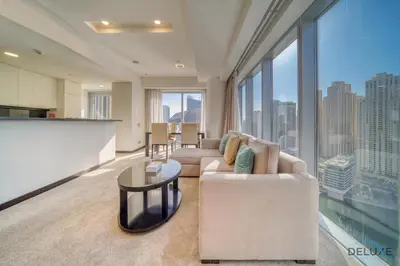 a living room with a couch and a table at Overlooking Marina Canal Views from Living to Bedroom, The Address Residences, Dubai Marina by Deluxe Holiday Homes in Dubai