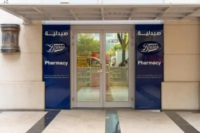 a entrance to a pharmacy with glass doors at BellaVista - Exuberant - 1BR - 29 Boulevard - Fountain Views in Dubai